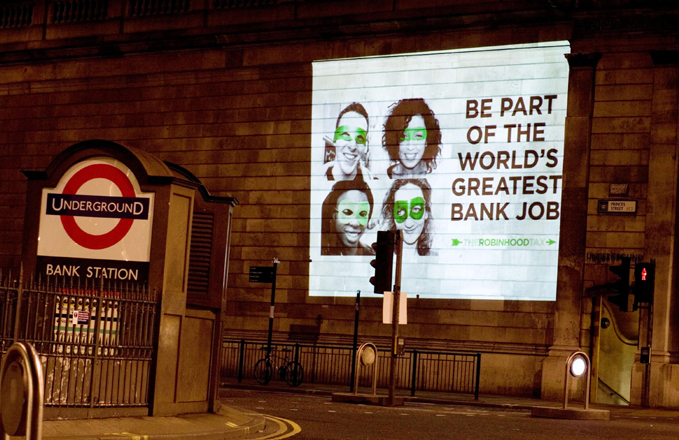 Robin Hood Tax ad campaign projected on the Bank of England - Photo credit: Martin Chilvers