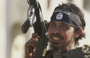 An anti-Gaddafi fighter takes part in a demonstration in Benghazi June 7 2012
