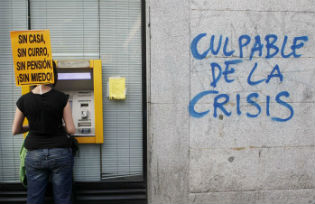Protestor at an ATM machine in Spain