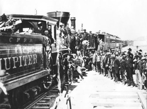 Celebration of completion of the First Transcontinental Railroad at what is now Golden Spike National Historic Site, Promontory Summit, Utah (1869)  - <a href="http://en.wikipedia.org/wiki/File:69workmen.jpg" target="_blank">Source</a>