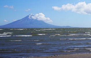 Lake Nicaragua, looking toward the Concepción volcano on Ometepe Island. The proposed canal would traverse the lake and require massive dredging, with potentially severe environmental consequences (photo credit: canterbury/Flickr).