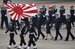 Self-Defence Force members march during an air review at Hyakuri air base in Omitama, Ibaraki prefecture, Japan. 