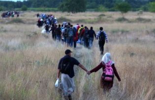 Migrants crossing the Macedonian border