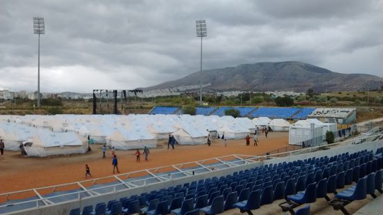 Former Baseball Stadium now home to a UNHCR tent city. Photo by Cecilia Keating