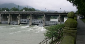The Great Dam of Dujiangyan was built in 256 BC to control the flow of water in the River Min, a tributary of the Yangtze. It is still in use to irrigate over 5,300 sq kms of farmland. The image shows part of the huge engineering project, the weir. The original has been replaced by a modern concrete structure.